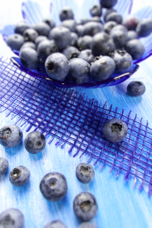 Blueberries  on wooden boardの写真素材