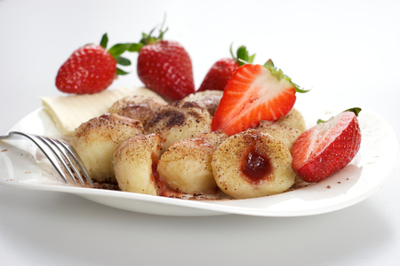 Delicious sweet dumplings stuffed with strawberries and cocoaの写真素材