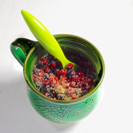 Fresh blueberries and cranberries with sugarの写真素材