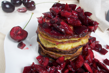 Hot sweet low carb pancakes with fresh cherriesの写真素材
