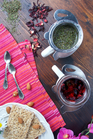 Beautiful morning with hot fruit cup of tea with healthy snackの写真素材