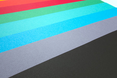 Colored group of empty papers on office desk for notesの写真素材