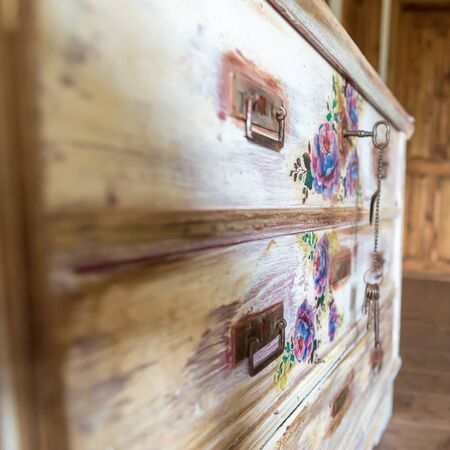 DIY concept, repair and renovation of old wooden furniture with floral decorationの写真素材