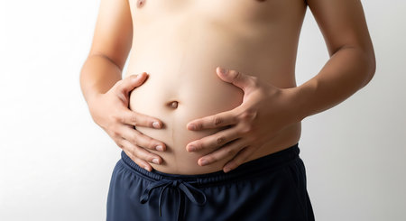 Pregnant woman with hands on her belly, isolated on white backgroundの素材
