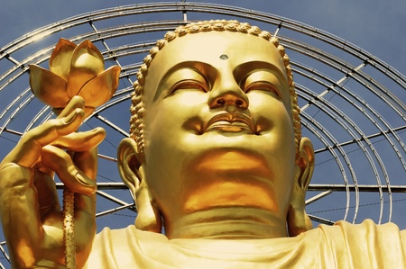 Big Golden Buddha with Lotus Flower at Da Lat, Vietnamの写真素材