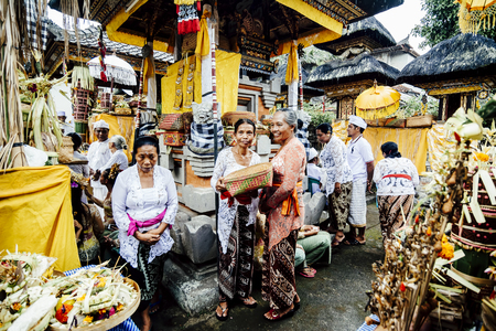 BALI, INDONESIA - DECEMBER 13: Balinese women in traditional costumes participating in Hindu ceremony in Bali on December 13, 2015のeditorial素材