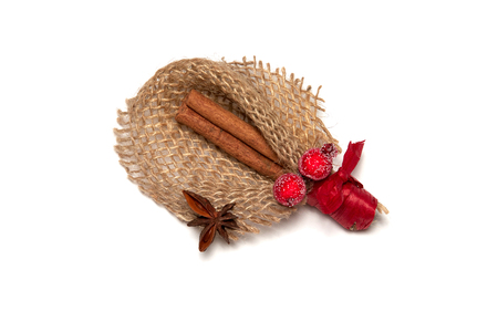 Cinnamon sticks in christmas decoration on white background.の写真素材