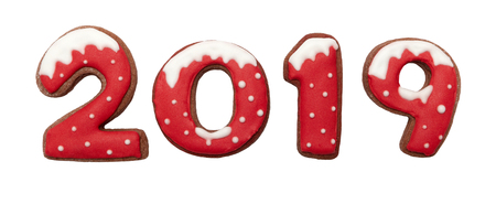 Ginger Christmas or New Year cookies in the form of numbers 2019. Seasonal packaging and New Year's attributes. Isolated on white.の写真素材