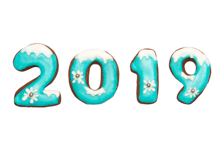 Ginger Christmas or New Year cookies in the form of numbers 2019. Isolated on white background. Seasonal packaging and New Year's attributes.の写真素材