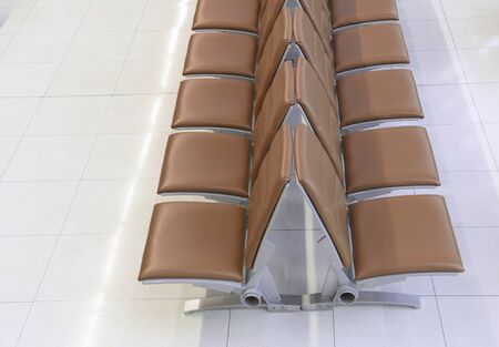 Row of seats for passengers in terminal before departure, interior area service in hall