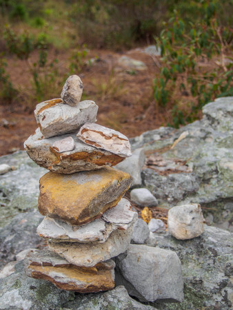 Stones stacked up on the rockの写真素材