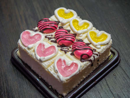 Vanilla cake on the dark wood tableの写真素材