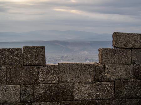 View of the sky looking through the old brick wall.の写真素材