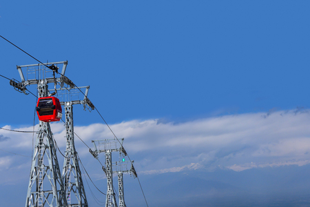 red cable car on blue sky with cloud background in Kashmir , Indiaのeditorial素材