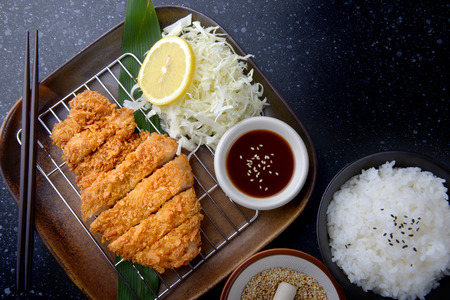 Japanese deep fried pork or tonkatsu set with rice in studio lighting.の写真素材
