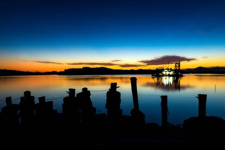 Sunset time at the beach with twilight  lanscape and dark cloud photo with outdoor sunset dark sky lighting.の写真素材