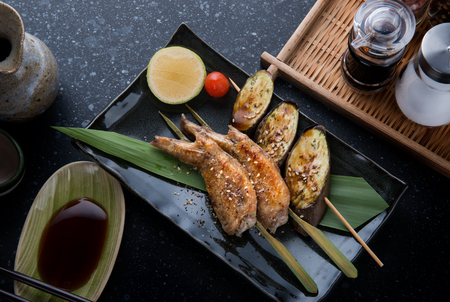 Grill chicken wing with salt seasoning in Japanese skewer grill food style.の写真素材