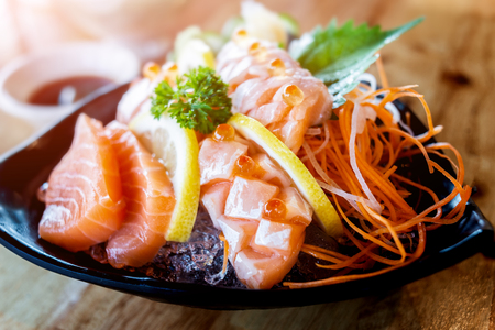 Salmon sashimi cutting and surve raw salmon fish in Japanese style food.の写真素材