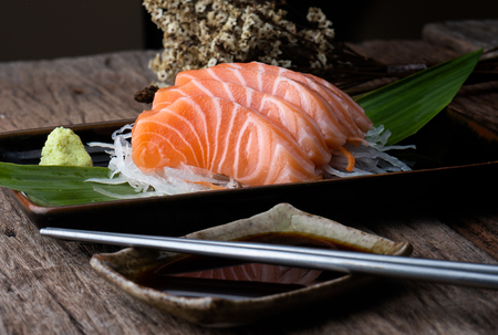 Salmon sashimi fresh and raw salmon fish slice ready to serve in Japanese food style.の写真素材