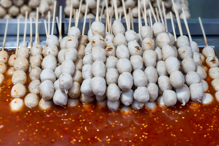 Street skewer food in Thailand style photo with outdoor low lighting.の写真素材
