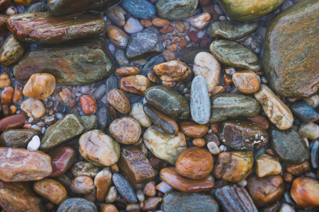 Mix colorful sea rocks background with grey tone color applied concept.