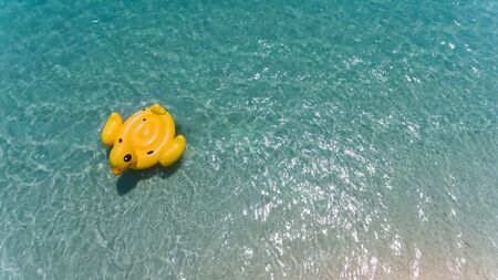 Top view from sky of duck swiming lifebuoy with outdoor sun lighting.の写真素材