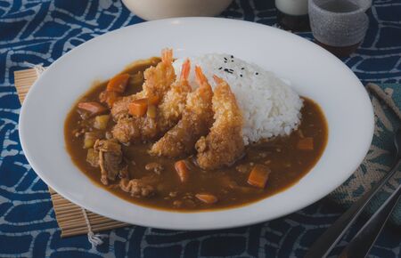 Japanese curry and fried shrimps with rice.の写真素材