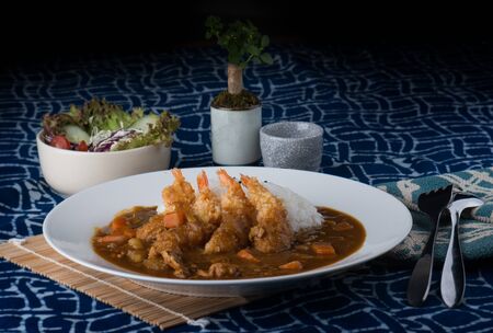 Japanese curry and fried shrimps with rice.の写真素材