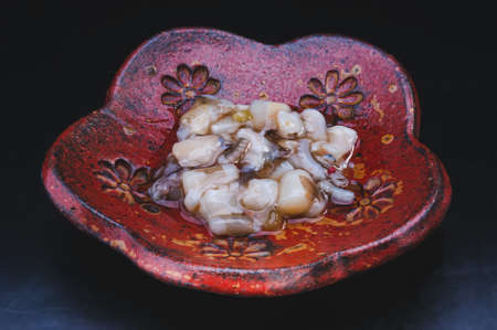 Japanese octopus or tako wasabi with black background.の写真素材