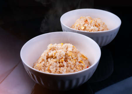Japanese fry rice cup teppanyaki style with indoor studio lighting.の写真素材