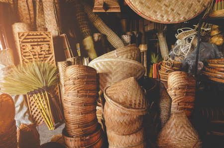 Hand made bamboo basketry appliance stock with indoor low and warm lighting.