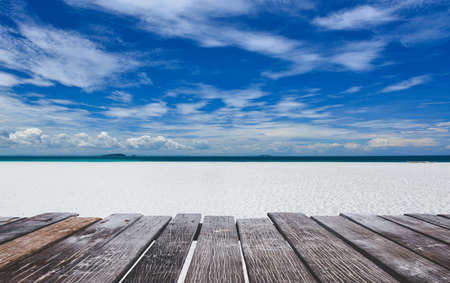 White sand beach view and wooden board  with sun lighting.の写真素材