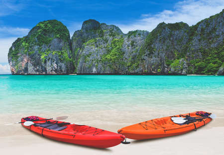 Island blue sea beach and kayak boat with outdoor sun lighting.の写真素材