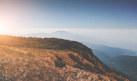 Mountain dry meadow and fog cloud scape view.の写真素材