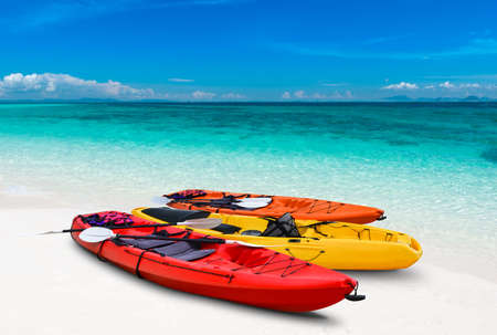 Blue sea beach and kayak boat with outdoor sun lighting.の写真素材