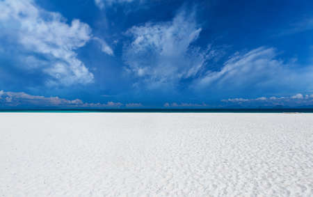 White sand beach  with clouds and blue sky sun lighting.の写真素材