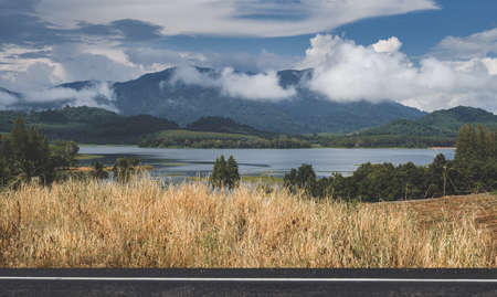 Mountain lake view with rainy season outdoor cloudy low lighting.の写真素材