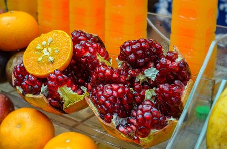 Cutting open show red seed of Street food Pomegranates fruit juiceの写真素材