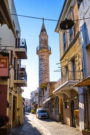 Beautiful view of narrow streets of old town of Chania, Crete, Greece in early morning. Historic monument of Ottoman era Ahmet-aga minaret.の写真素材
