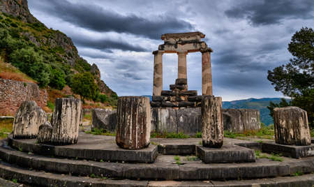 Rear view of ruins of Tholos of ancient Greek goddess Athena Pronaia in Delphi, Greece. Parts of Doric columns.の写真素材
