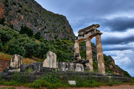 Ruins of Tholos of ancient Greek goddess Athena Pronaia in Delphi, Greece. Restored three Doric columns.  Rear viewの写真素材