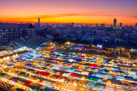 Beautiful sunset over Bangkok, Thailand, and colorful night market.の写真素材