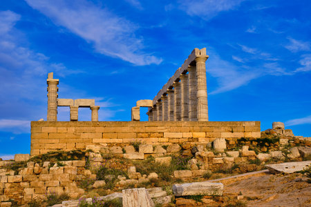 Sunset sky and ancient ruins of temple of Poseidon, Sounion, Greeceの写真素材