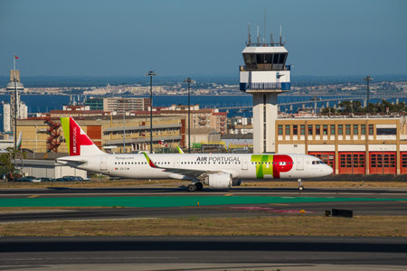 Jul 23, 2023 - Lisbon, Portugal. Air Portugal or TAP airplane on runway of Lisbon airport on sunny dayのeditorial素材