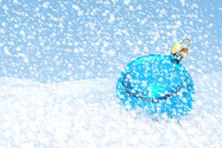 Blue Christmas ball on the snowの写真素材