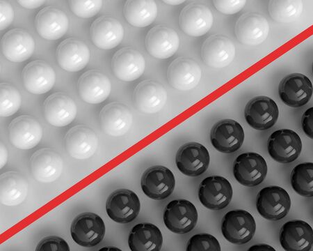 White and black spheres separated by a red lineの写真素材