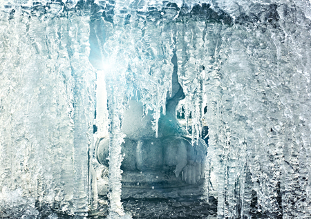 Frozen water in fountain with a rays of  light, close-up viewの写真素材