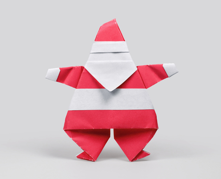 Origami paper Santa Claus on gray backgroundの写真素材