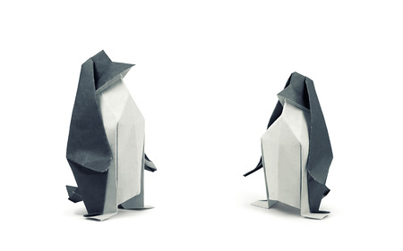 Two origami penguins isolated on white background. Clipping path includedの写真素材