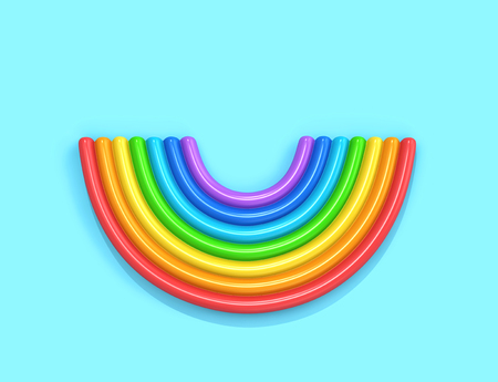 Inflatable rainbow isolated on blue background, top view.の写真素材